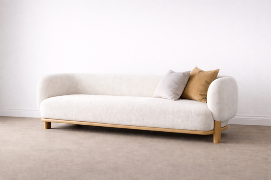 White sofa with wooden legs and two cushions
