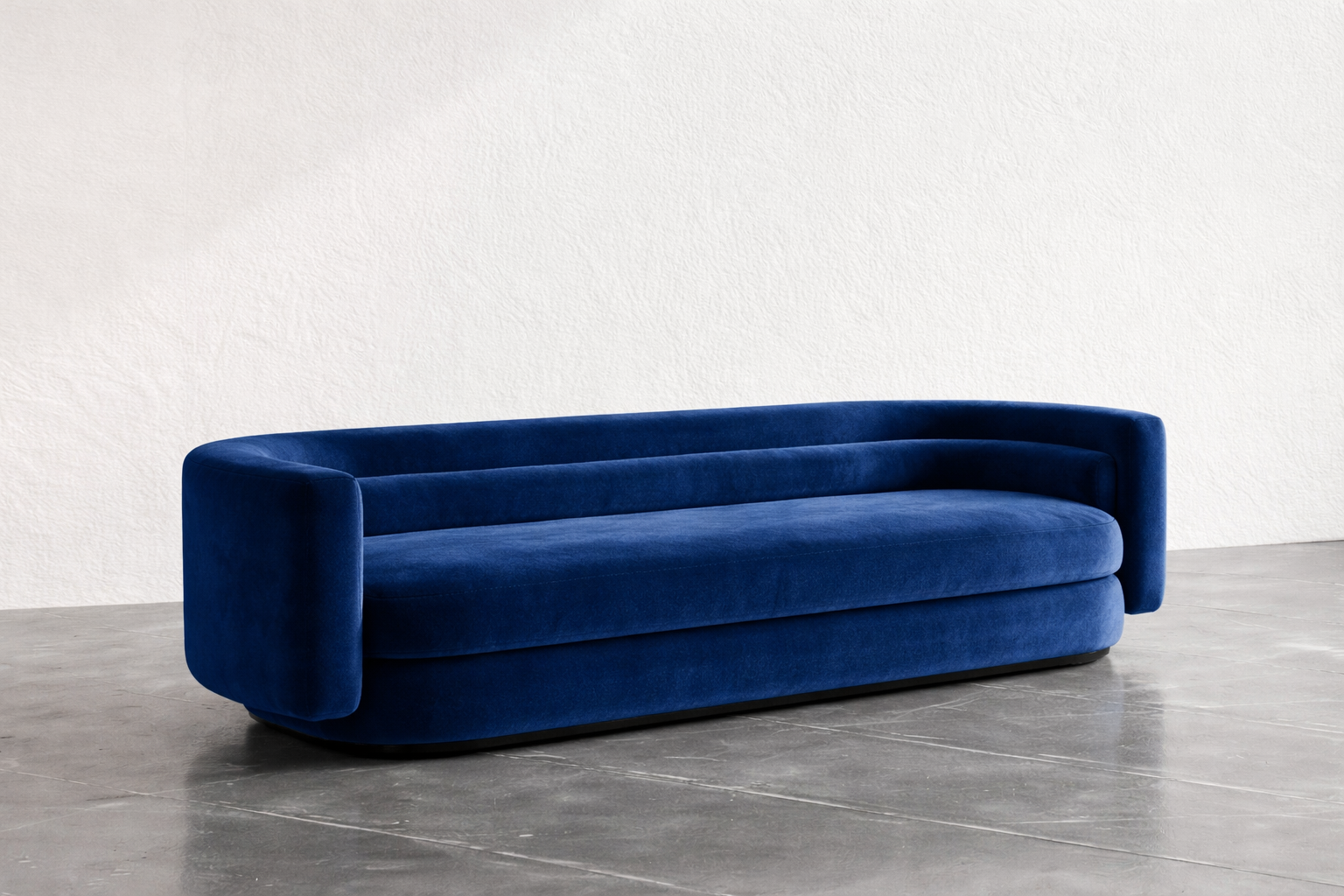 Blue sofa on a gray floor with a white wall background
