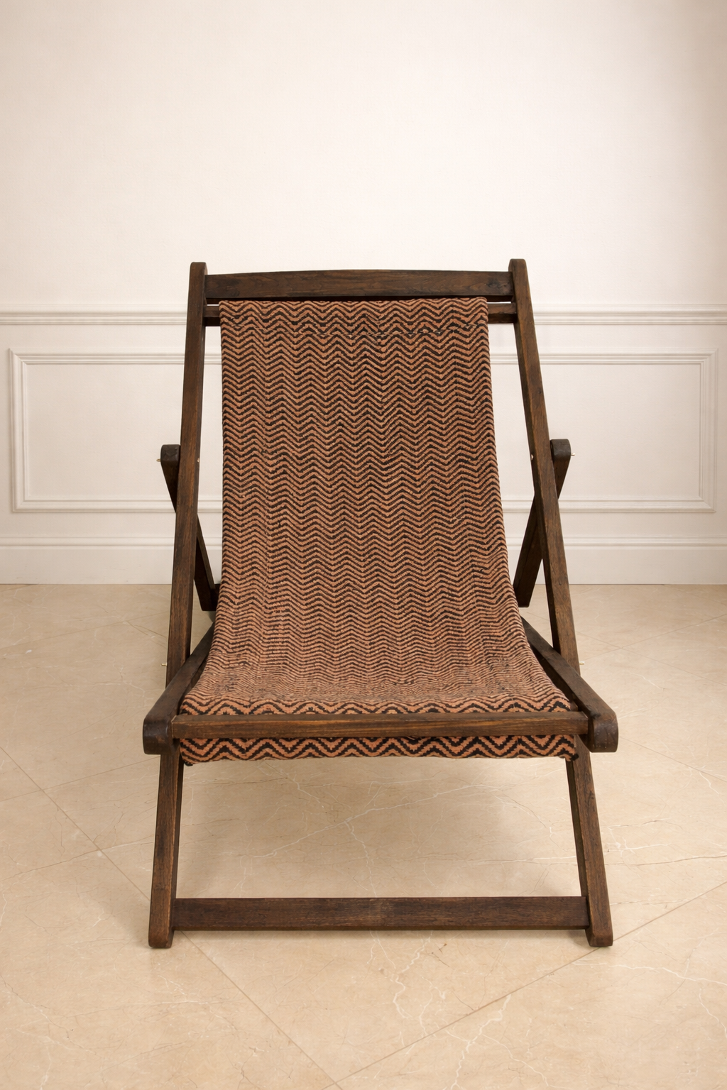 Wooden chair with woven backrest on a beige floor and white wall background